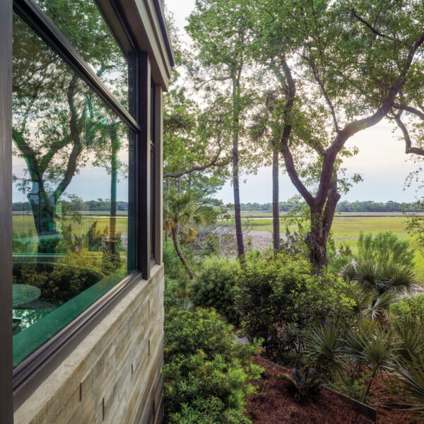 The South Carolina Lowcountry Retreat Perfect For Artists And Art Lovers home’s board-formed concrete exterior with views of marshland