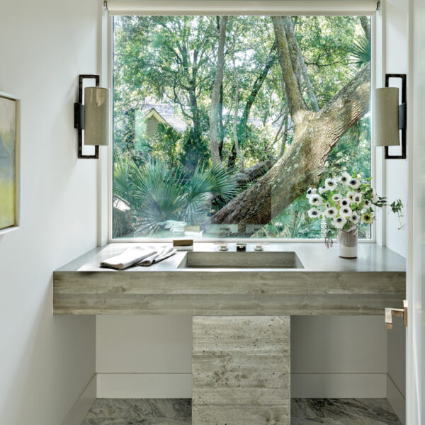 The South Carolina Lowcountry Retreat Perfect For Artists And Art Lovers powder room with picture window and concrete vanity