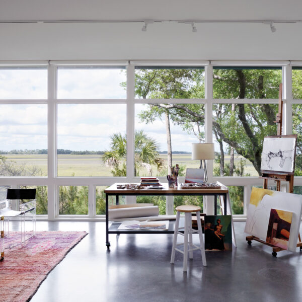 The South Carolina Lowcountry Retreat Perfect For Artists And Art Lovers art studio with lofty windows and concrete floor
