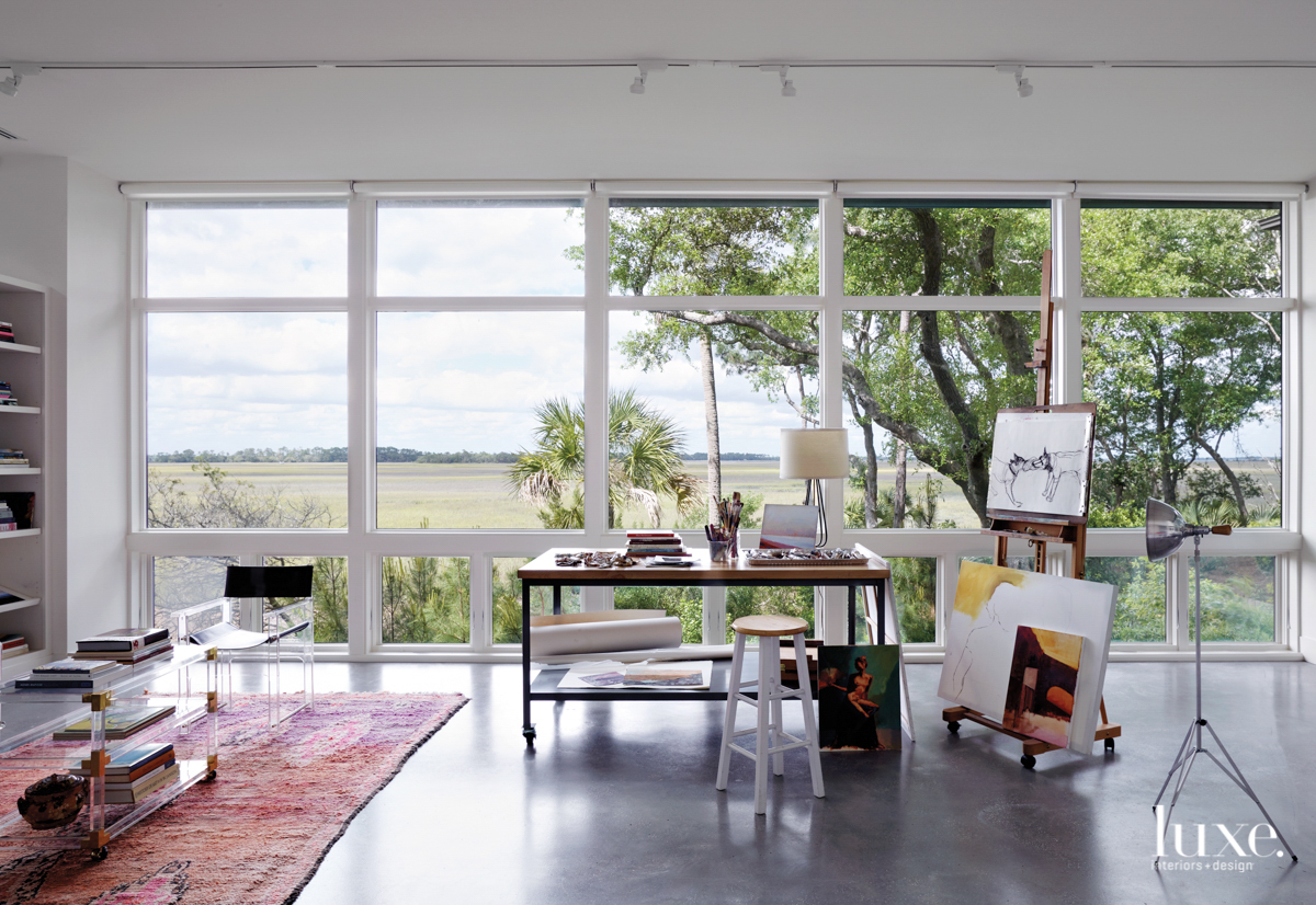 art studio with lofty windows and concrete floor