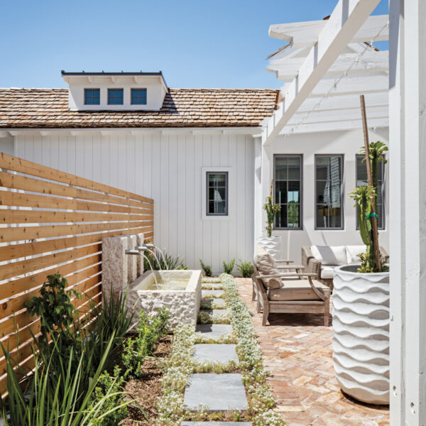 Never Underestimate The Power Of Comfort. Inside A Modern AZ Farmhouse With Beachy Accents. side courtyard features the landscape architecture and fountains