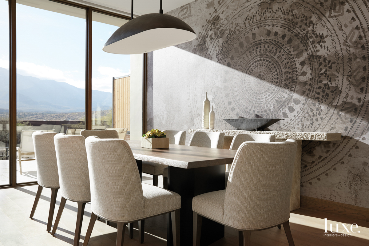 dining area with rectangle table and chairs with mural on wall