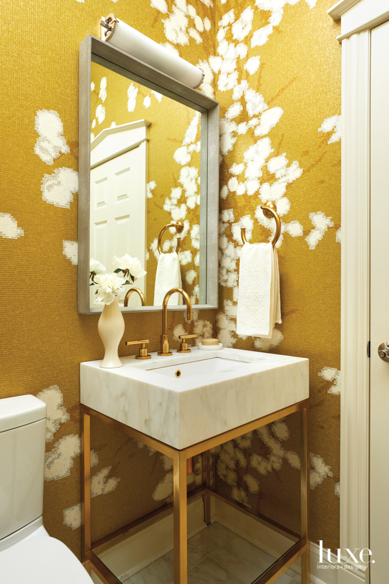 powder room with gold and...