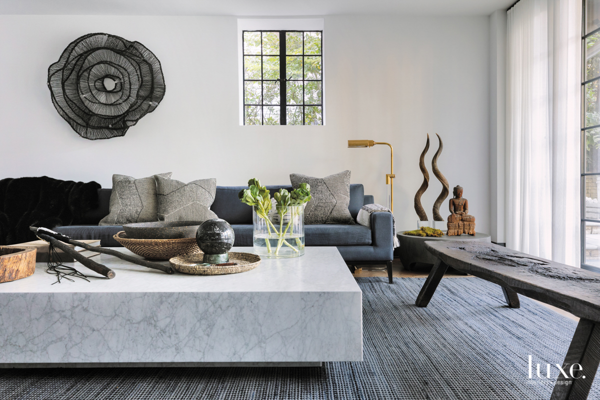 gray modern family room features collected art and objects