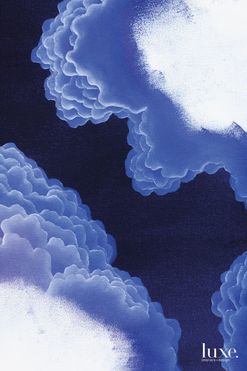 A detail of a Guese painting showing blue, fluffy clouds