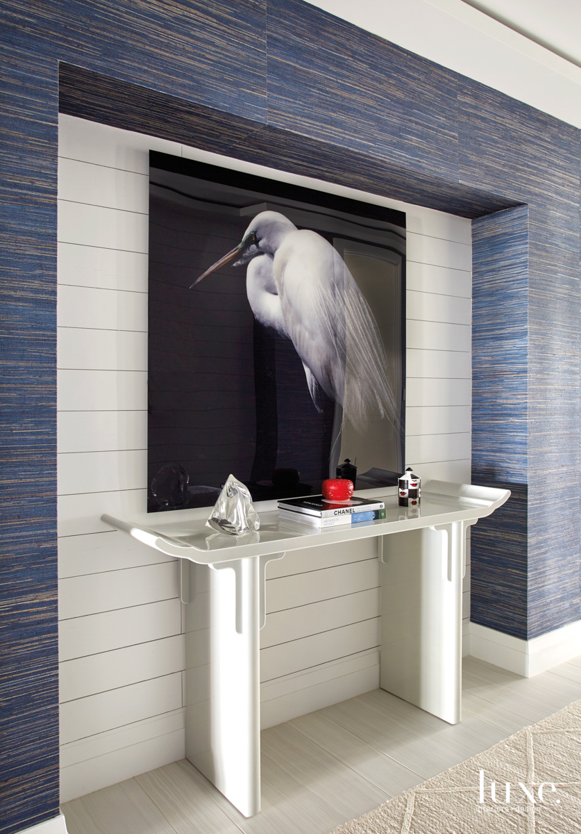 back hall featuring a largescale bird photograph above a table