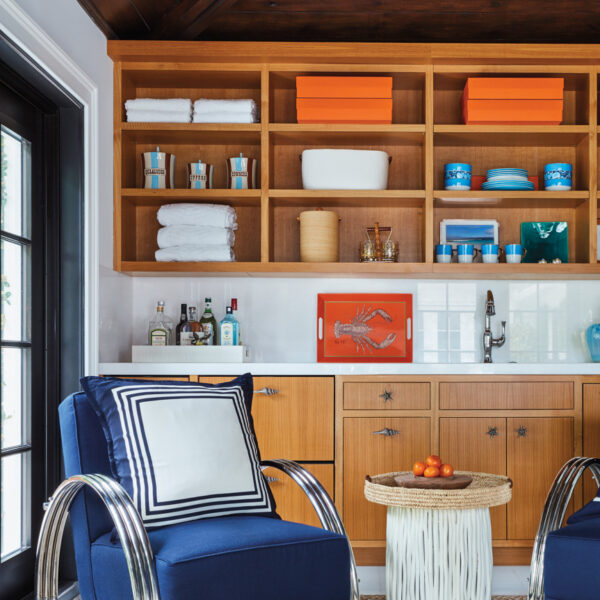 Zen Out In A Beautifully Layered Palm Beach Retreat With A Connection To The Outdoors oak tongue-and-groove ceiling panel with a wet bar and blue arm chairs