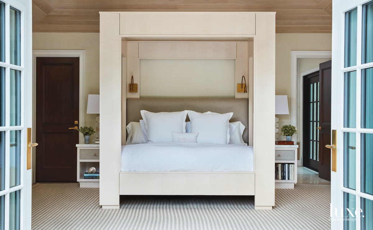master bedroom features the bed with square canopy and tables