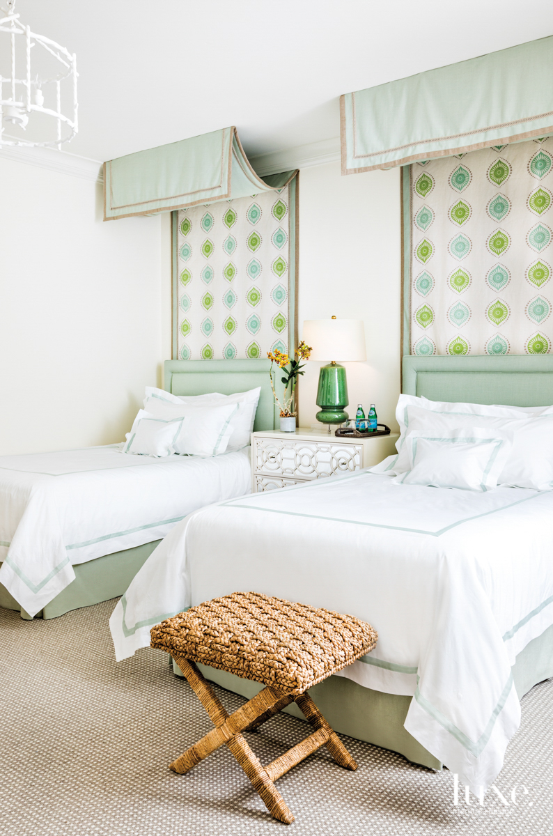 children's bedroom with twin beds with green canopies