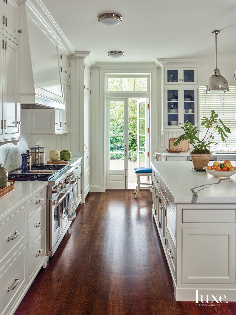 white kitchen with blue cabinetry