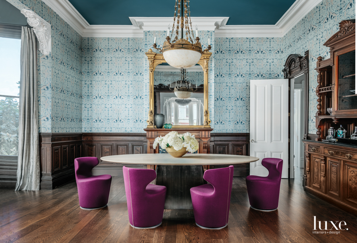 dining room with blue walls and ceiling, and purple chairs