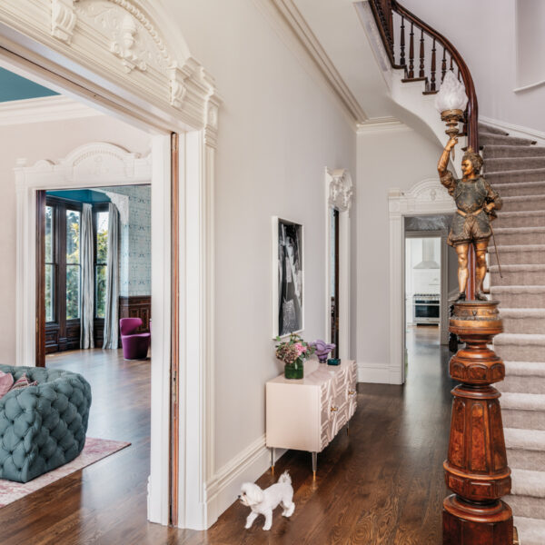 The SF Grand Victorian That Proves Honoring History Still Saves Room For Plenty Of Personality view from front door of staircase with dog