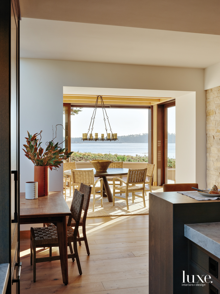 From the kitchen, you can look through the dining room to the bay.