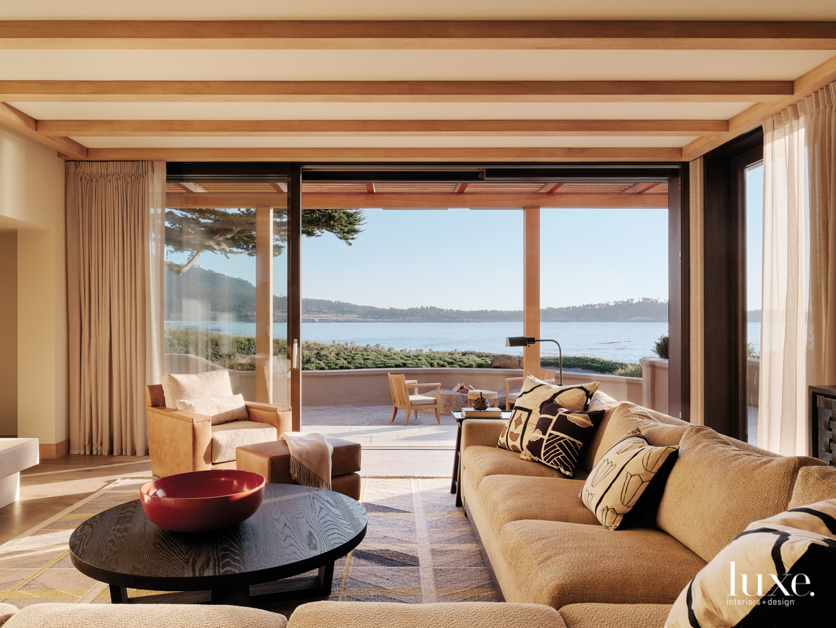 From the living room, you can look through large windows to the bay.