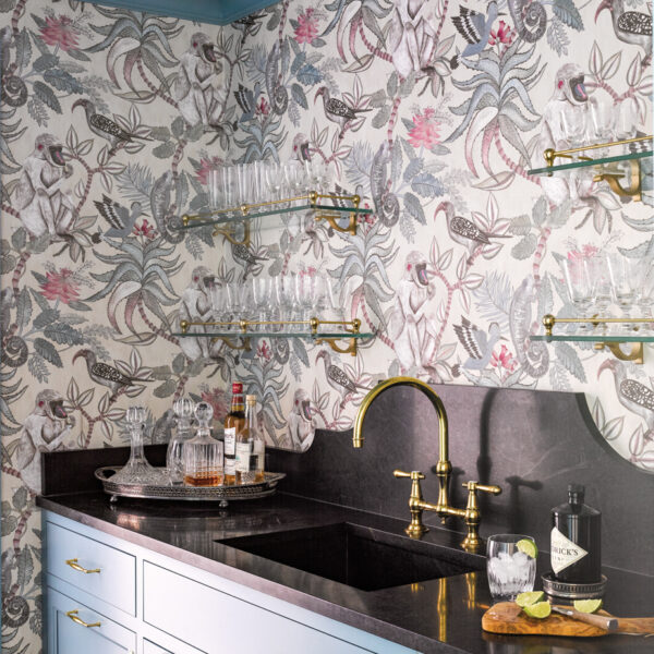 Nostalgia And Timeless Good Style Beckon In A 1939 N.C. Abode butler’s pantry with plant and birds patterned wallpaper, blue cabinetry and black marble countertop