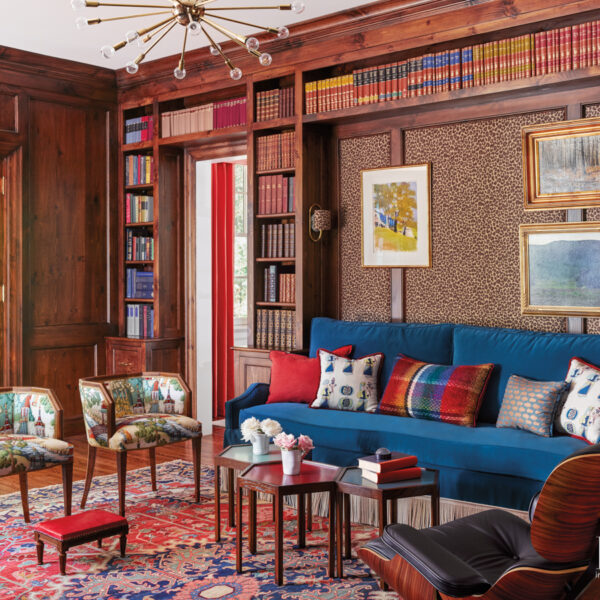Nostalgia And Timeless Good Style Beckon In A 1939 N.C. Abode library with leopard print wallpaper, blue sectional and geometric tables