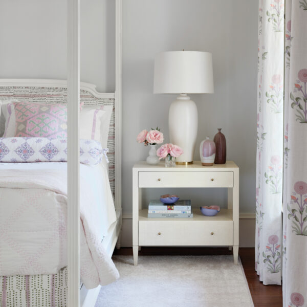 Consider This South Carolina Vacation Home An Ode To Summer And Sunrises white guest bedroom with floral draperies