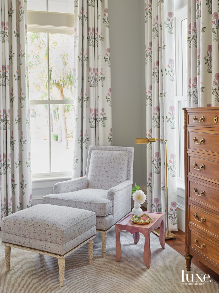 guest bedroom with chair and ottoman in quadrille's crawford linen light lavendar