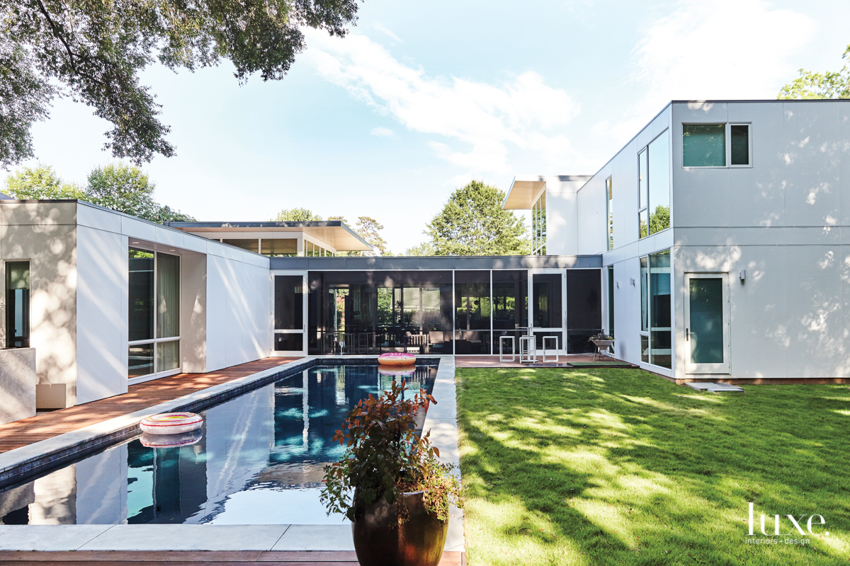 interior courtyard view of large modern house and long swimming pool