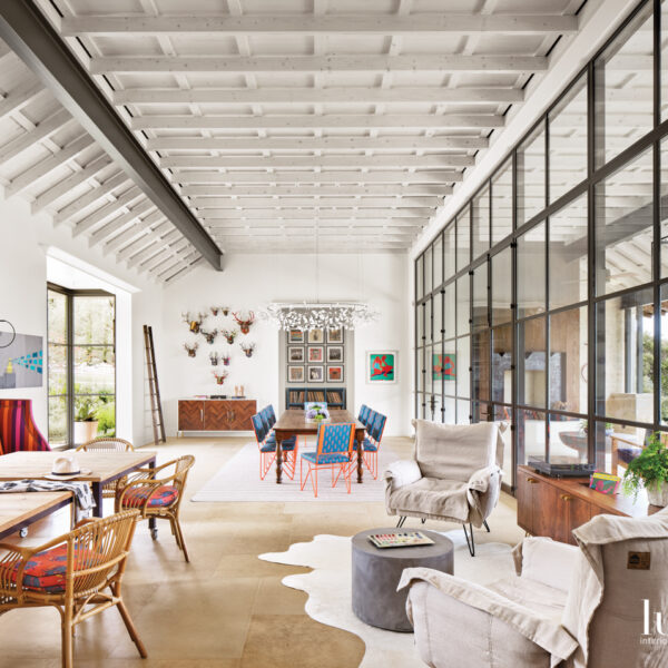 Ditch The Bunks: A Texas Home Channels A Sophisticated Summer Camp Vibe Light and airy great hall with a series of living and dining spaces