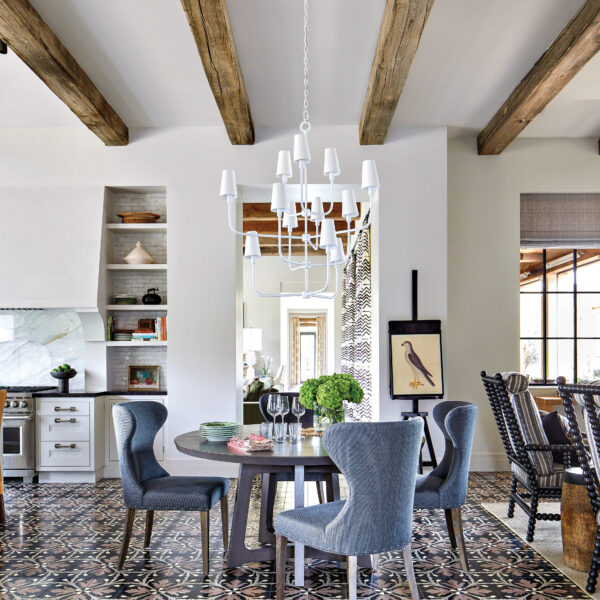 A Stunning Mountain Backdrop Elevates The Luxe Factor Of This Mediterranean-Style Arizona Villa Black patterned tile draws the eye to the dining room floor
