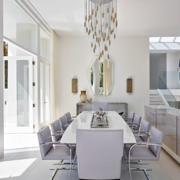 Behind The Thoughtful Alterations Of A Beverly Hills House Dining room with chairs and table