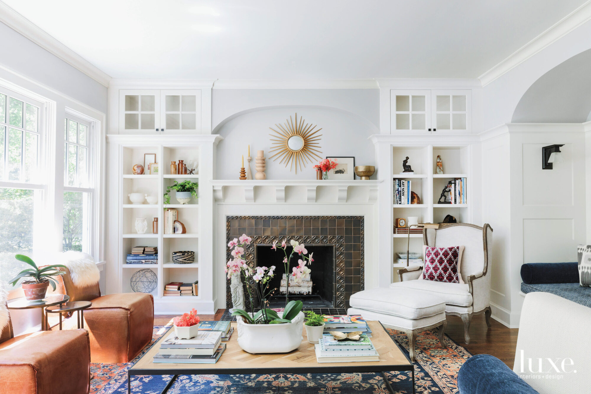 Built-in shelves surround the fireplace in the living room