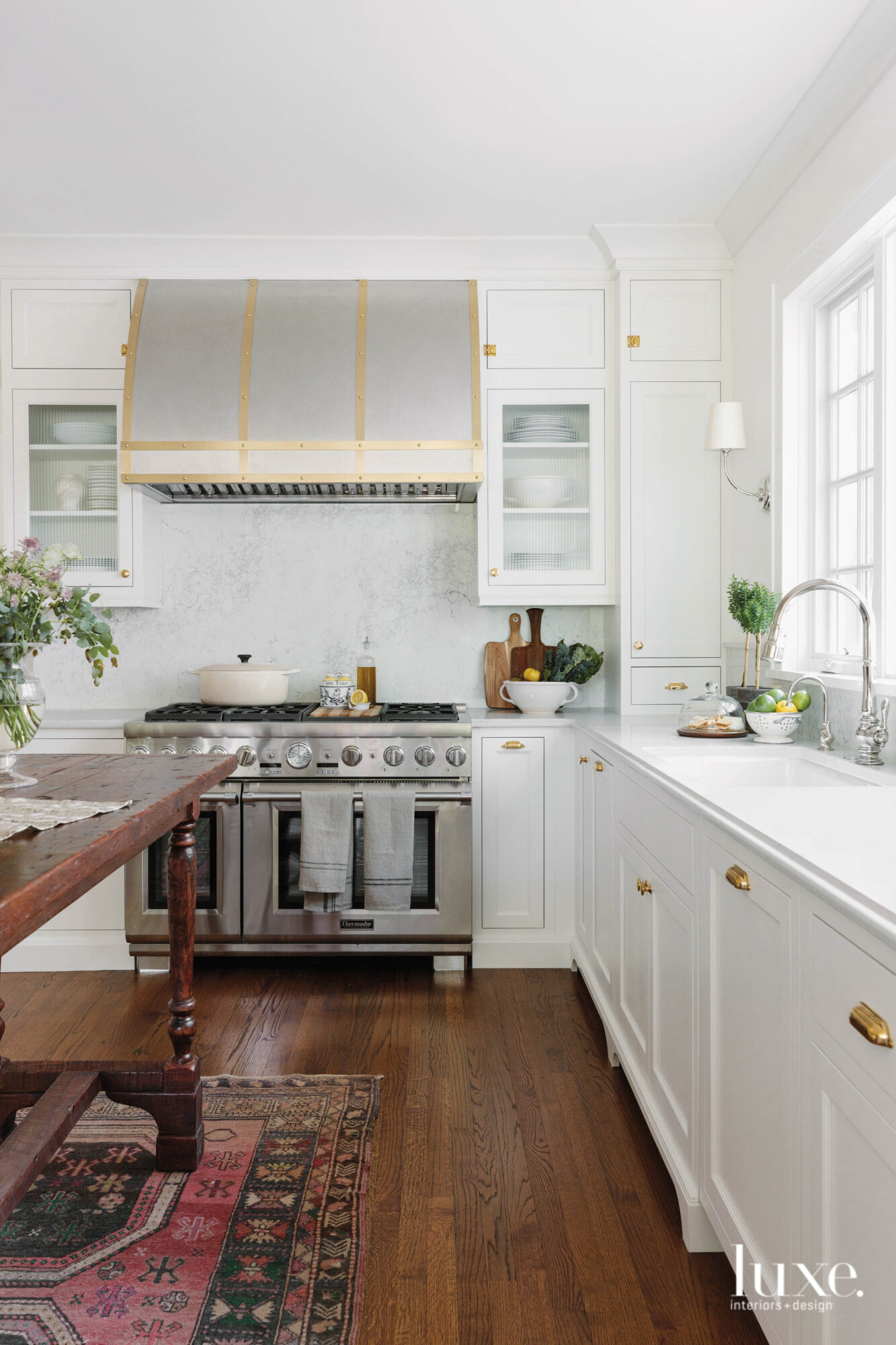 Brass finishes add an industrial touch to this modern country kitchen