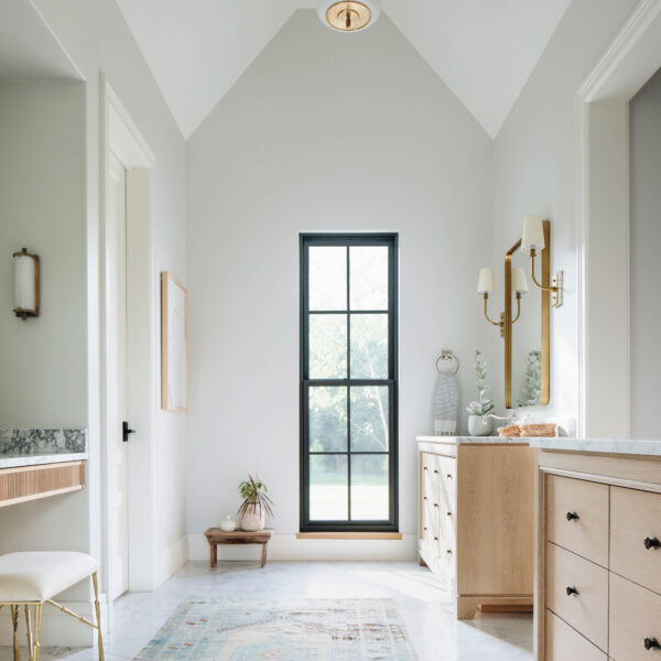 Peek Inside This Chicago Farmhouse To Be Transported To The Belgian Countryside White oak vanities match perfectly with the gold finishes in this master bath.