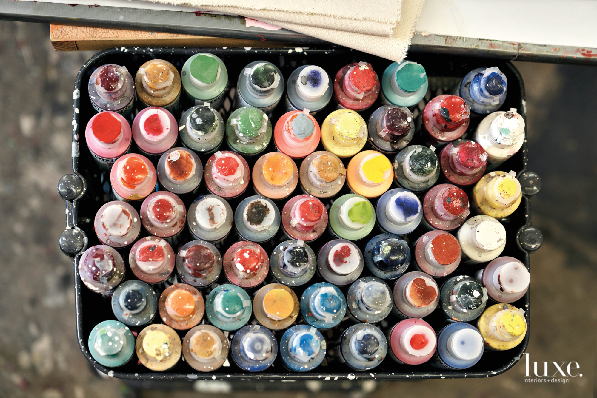 A row of paint bottles.