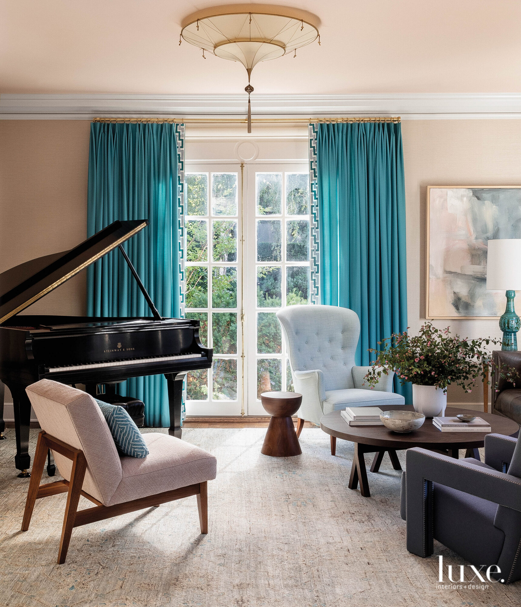 Living room with blue draperies and grand piano