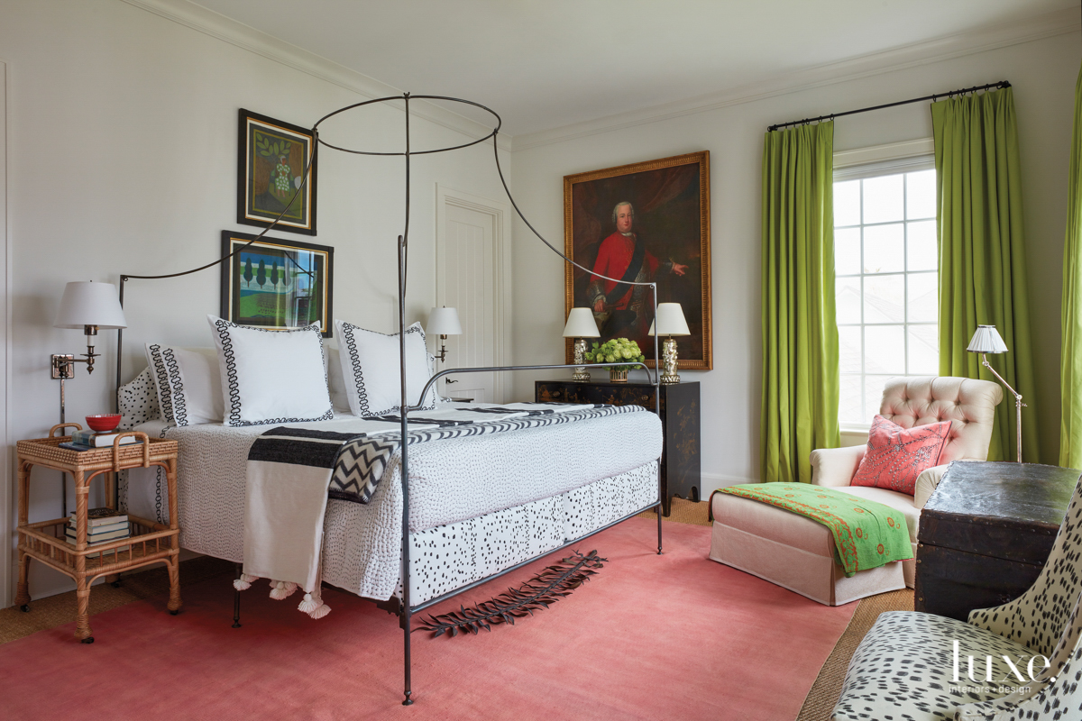 beedroom with coral rug, green drapes, anthropologie bed