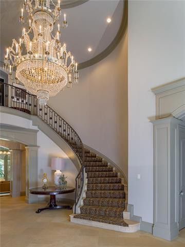 winding staircase with chandelier kips bay dallas show house
