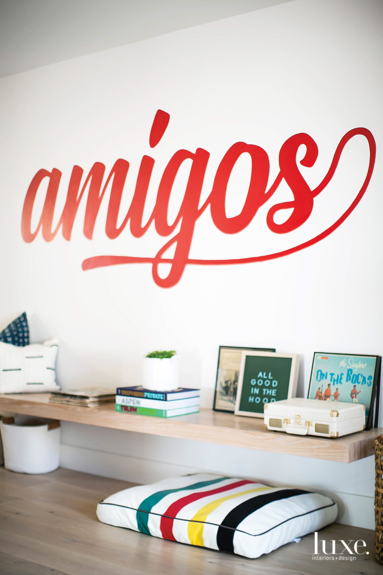 Family room wall detail with word amigos painted in red