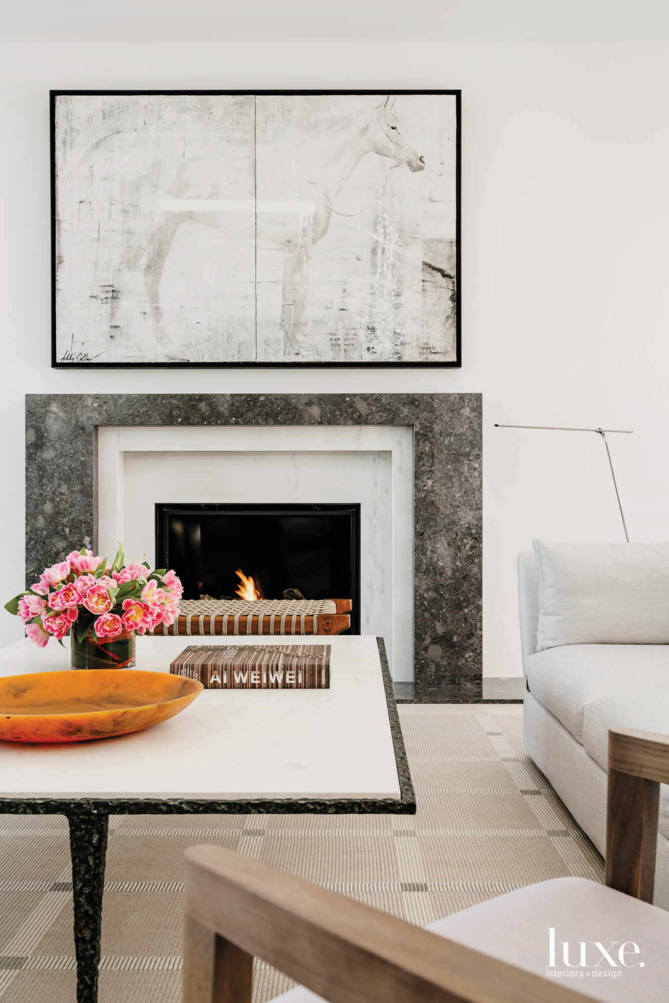 AShley Collins painting hangs above the fireplace.