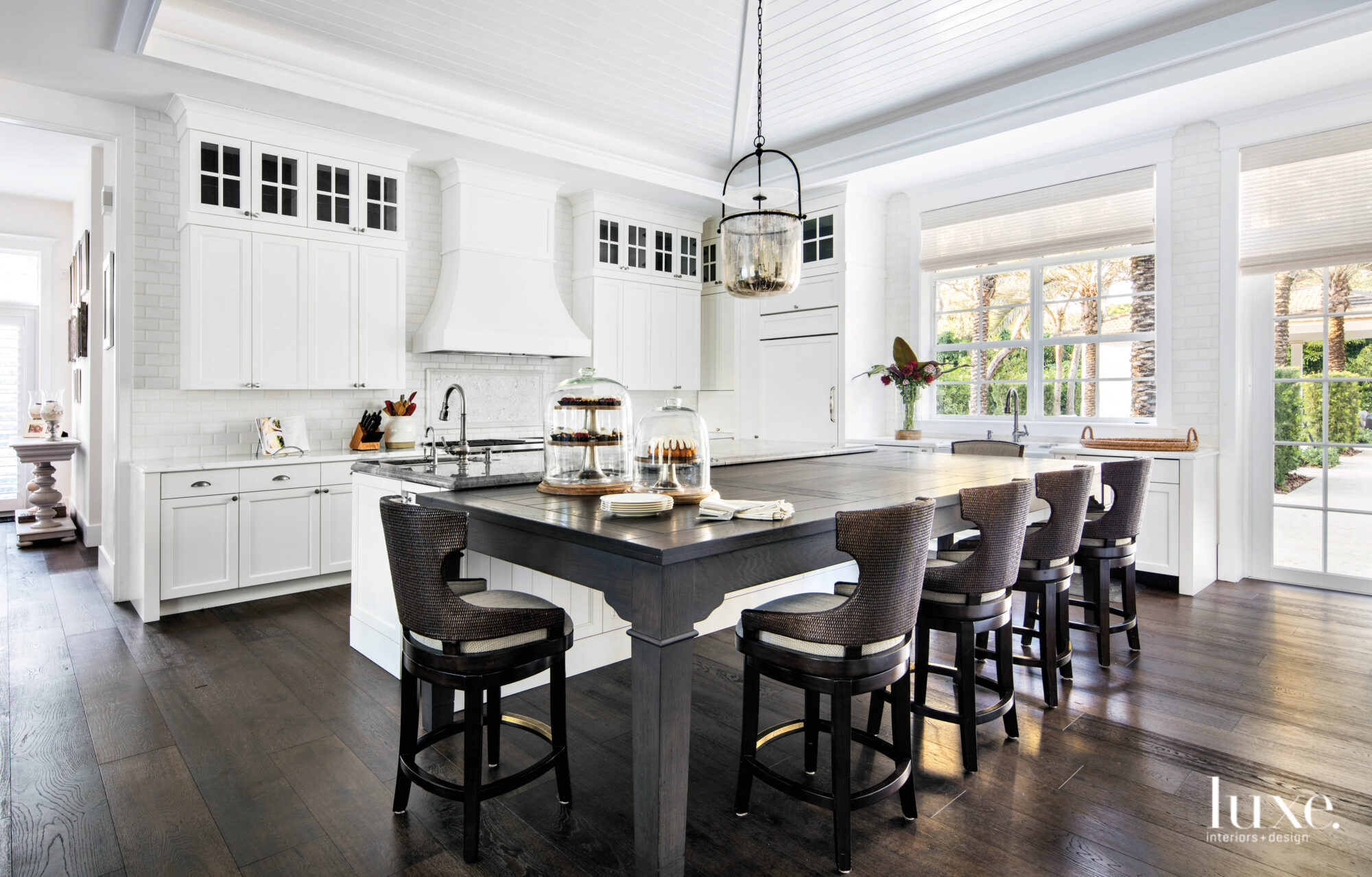 Kitchen with white cabinetry and dark gray eat-in counter