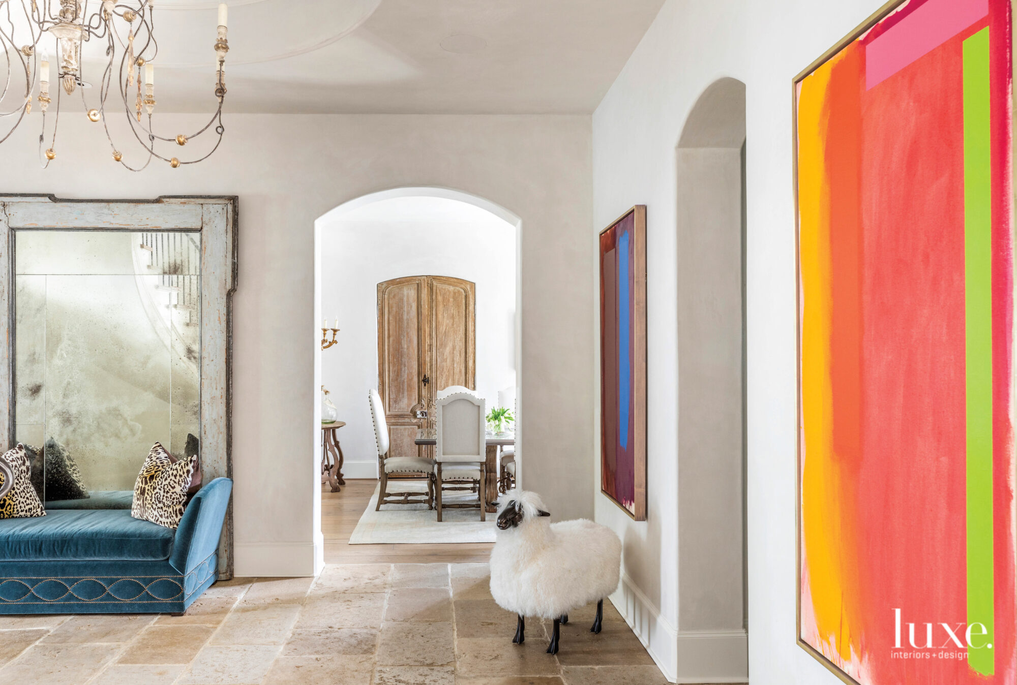 Dining room vestibule with colorful abstract art.