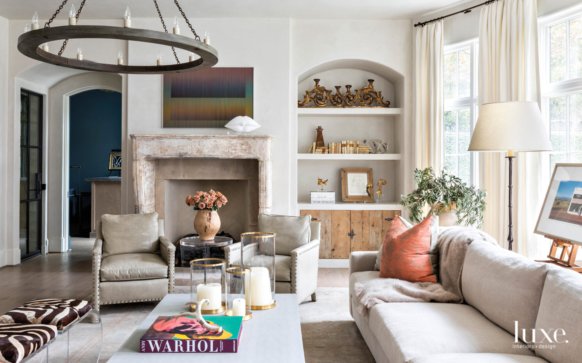 Great room with neutral furnishings and colorful accents and art.
