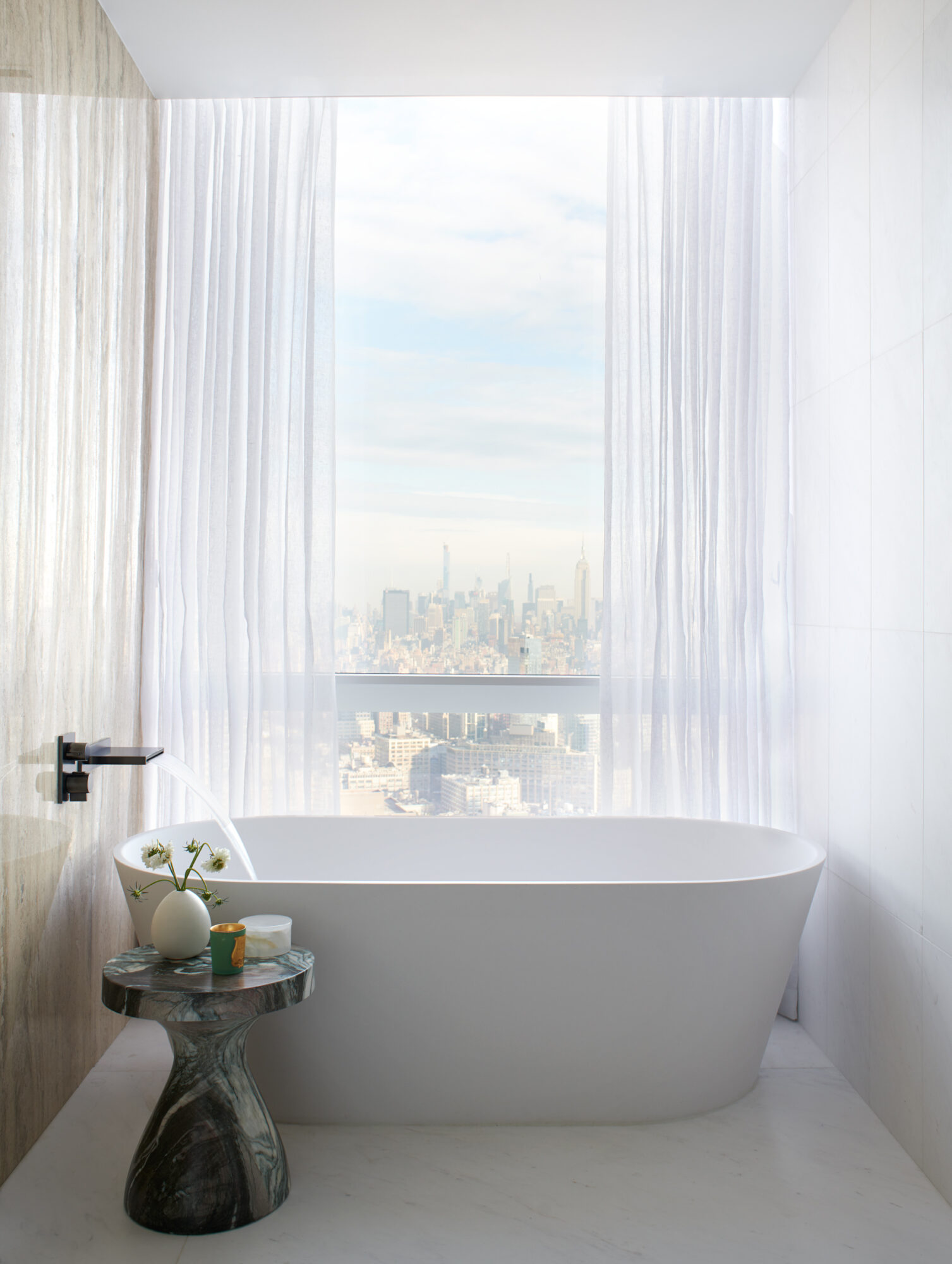 The city skyline is the perfect backdrop, even behind the bathtub