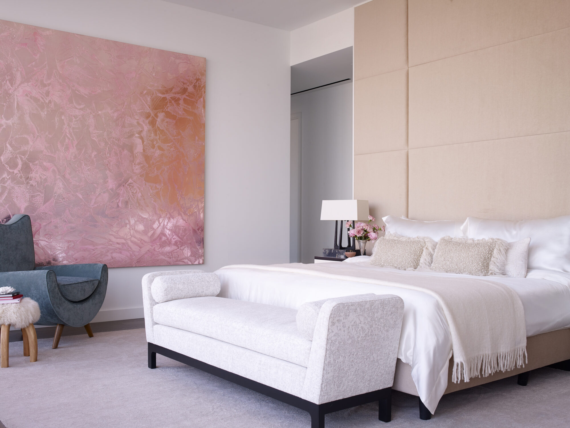 Different shades of pink define this spacious bedroom