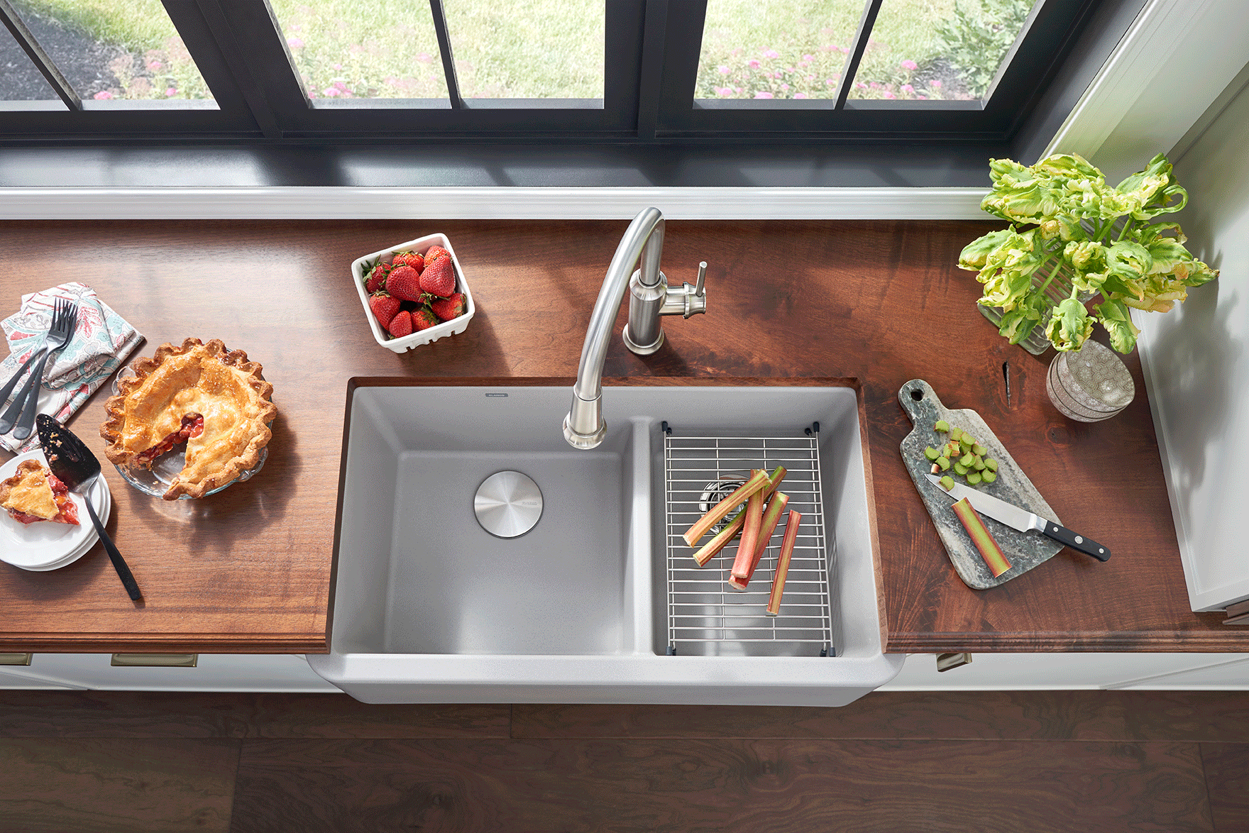 brown counter with silver sink and vegetables