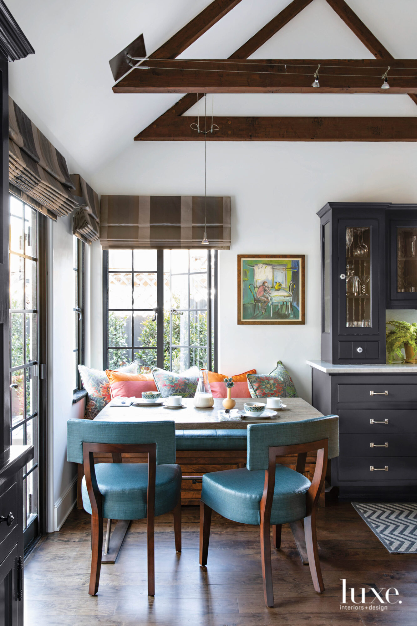 Breakfast nook with pair of blue chairs