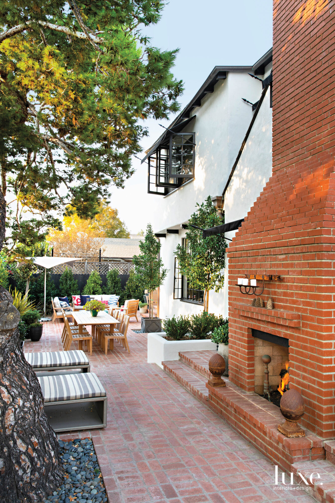 Terrace view with dining area and outdoor fireplace