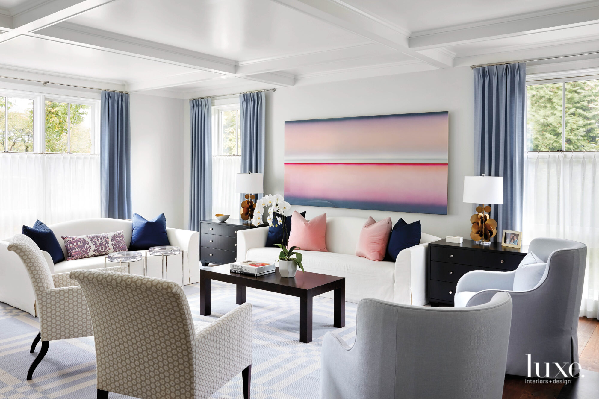 white living room with shades of blue and pink