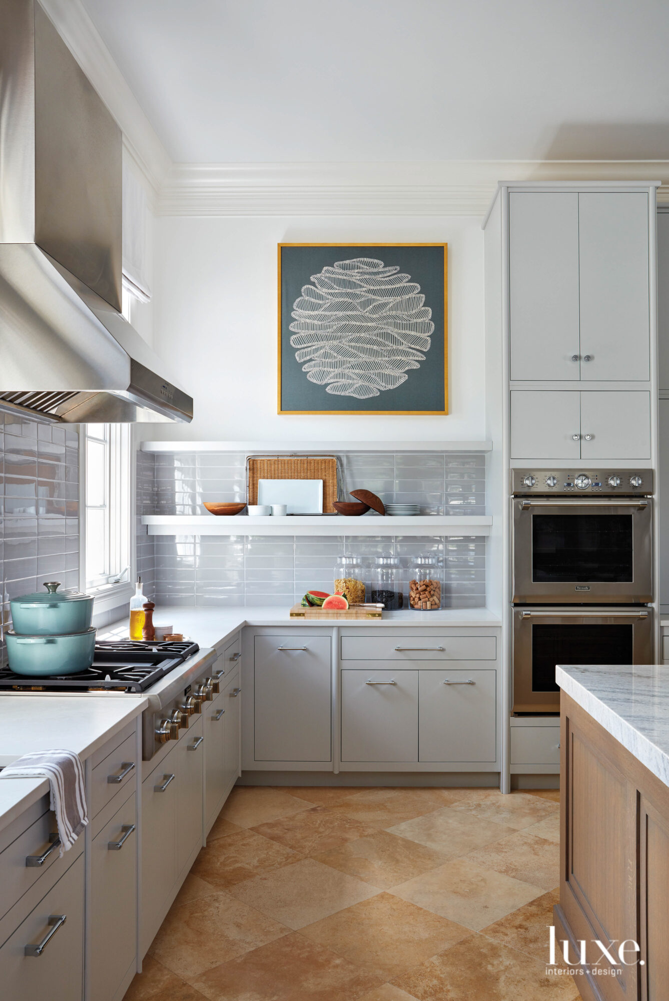 Kitchen with bluish gray cabinetry...