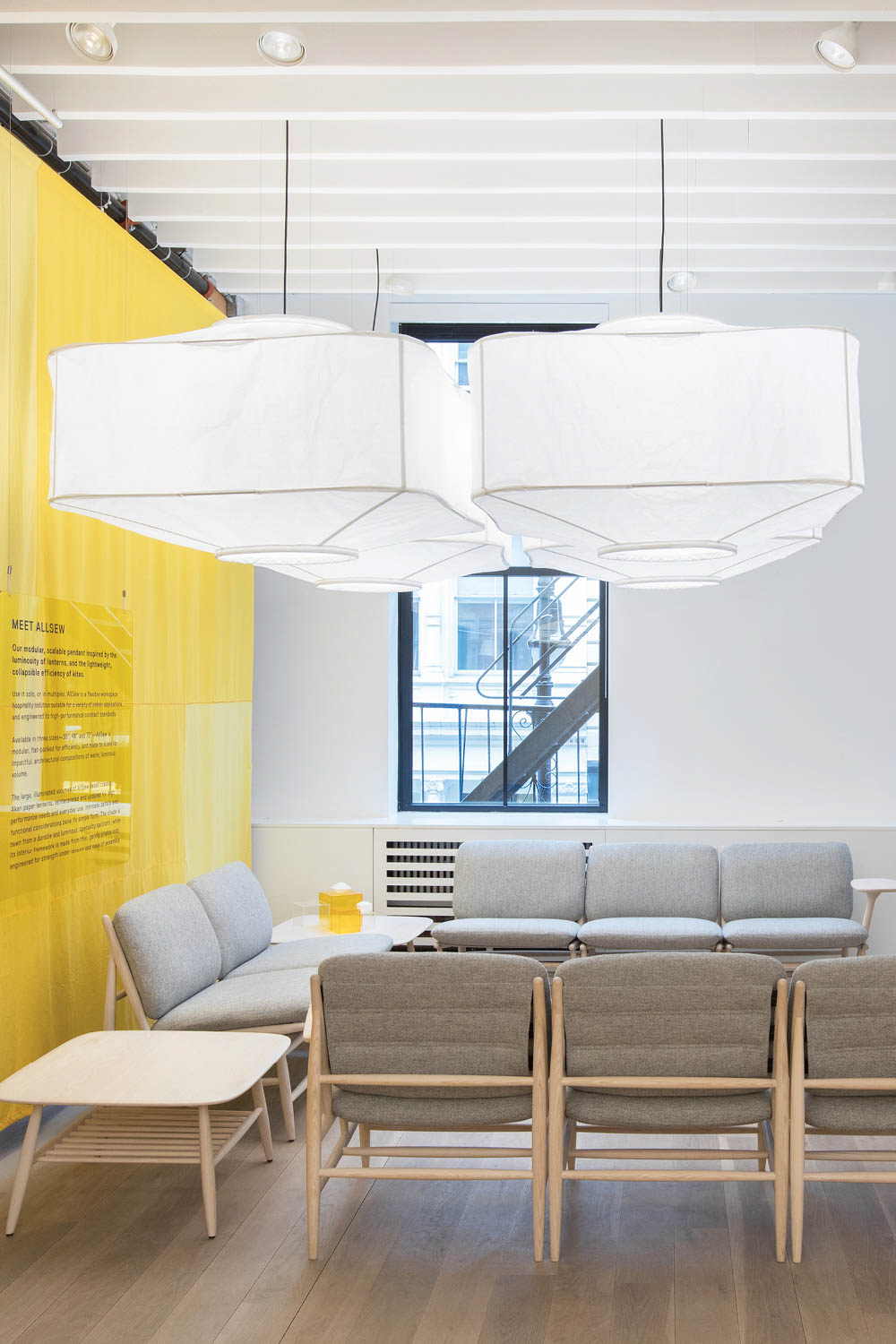 seating area with large white pendants hanging over