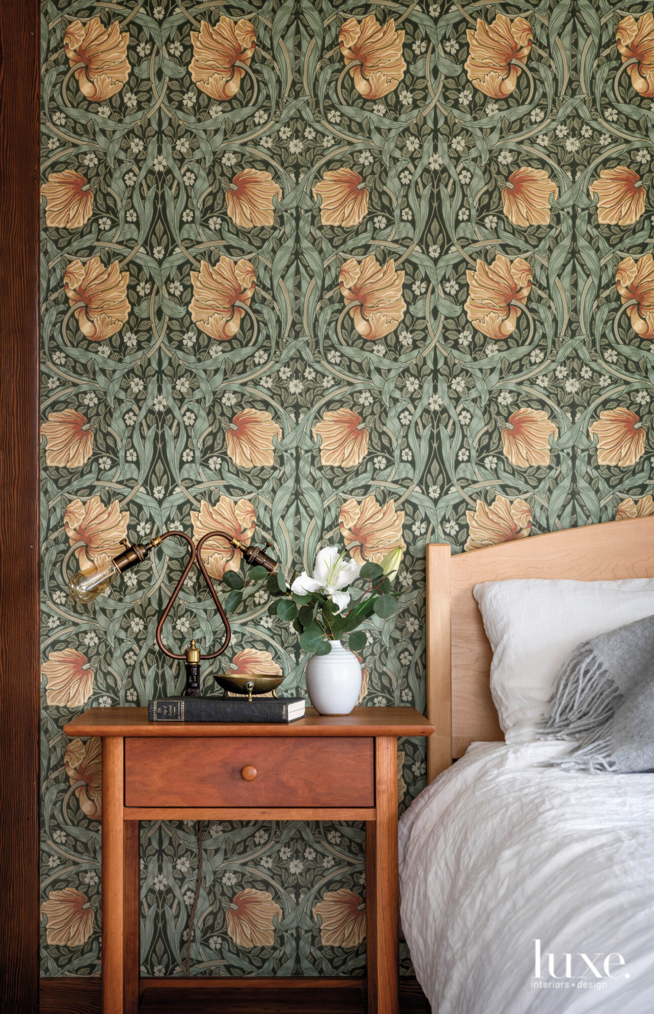 Detail of bedroom with william morris wallpaper