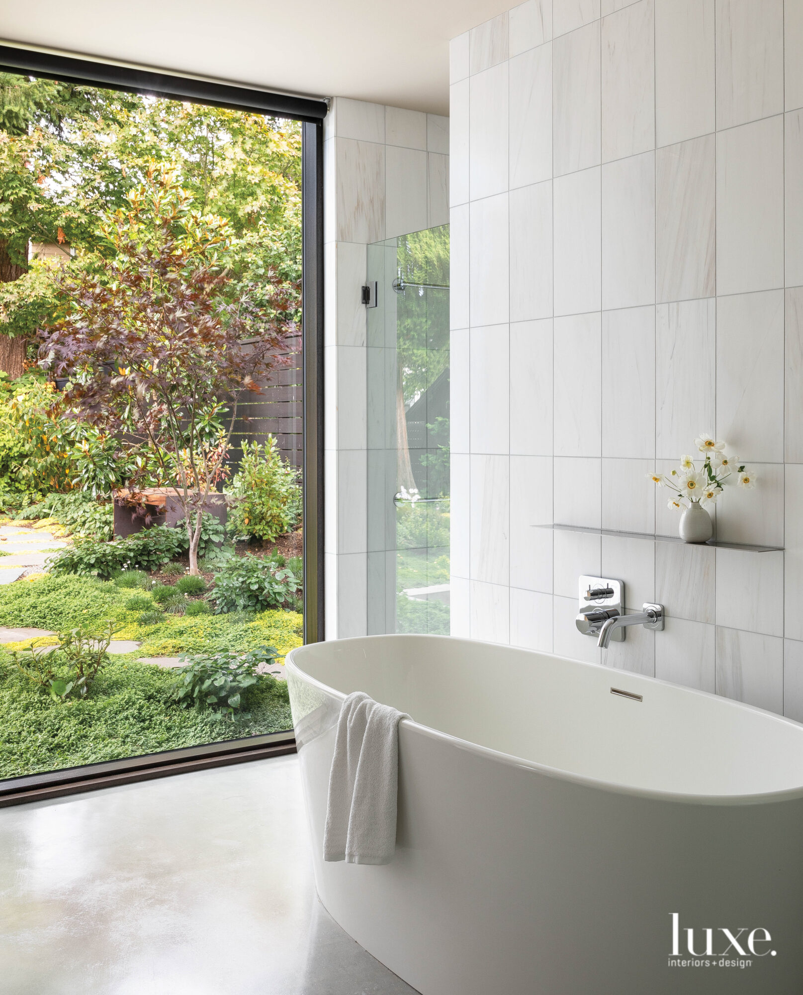 Main bath shot of freestanding tub with view to outside