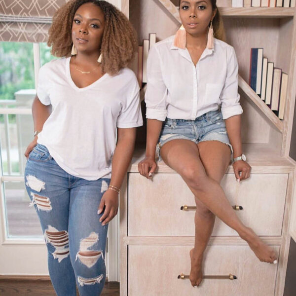 two designers wearing white shirts and jeans