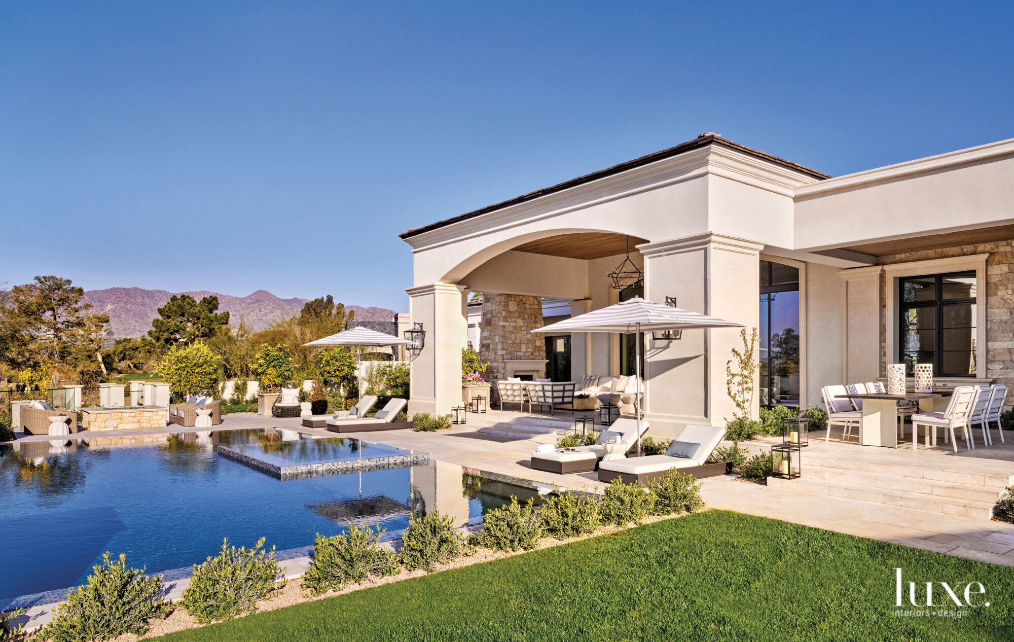 The backyard of the Mediterranean-style home which features a pool and plenty of entertaining areas.